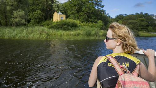 Visitors on a boat trip on Upper Lough Erne at Crom, County Fermanagh, Northern Ireland.